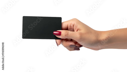 A hand with red nails holds a black, rectangular card against a black background
