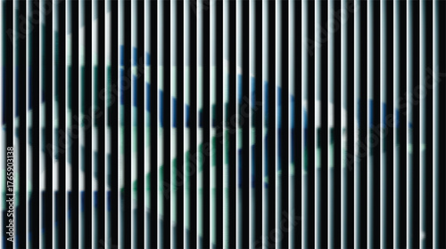 Abstract pattern of vertical metal blinds with blurred city reflections