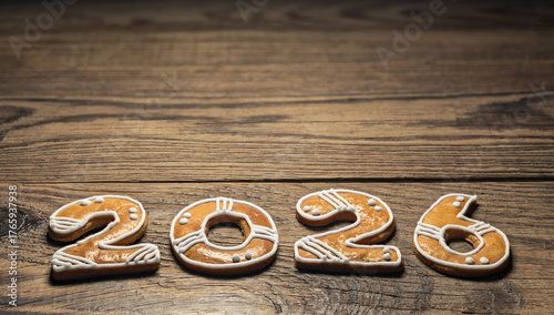 Foto Closeup of gingerbread 2026 number for New year greetings on vintage background