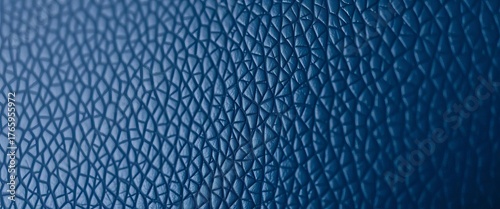 Deep indigo leather, subtly textured with fine grain, detail, full frame