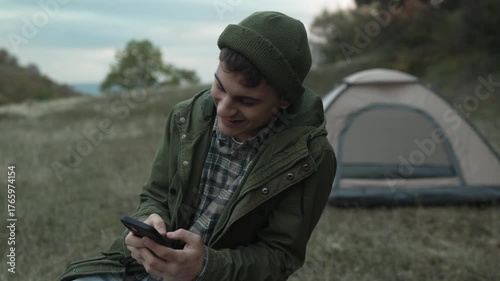 Young man having video call outdoors