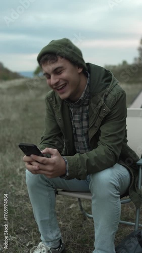 Young man having video call outdoors