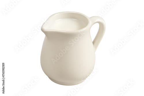 White ceramic creamer pitcher holding milk