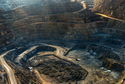 The immense scale of a copper mine in Chile, with roads winding down the massive open pit to the mining area.