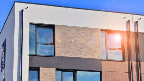 Newly built terraced houses in a residential area. Modern terraced houses on the outskirts of the city.