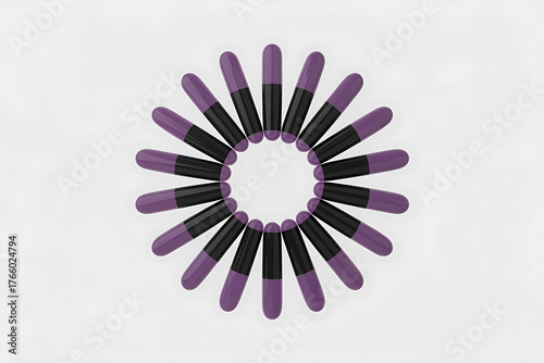 Arrangement of purple and black pencils radiating outward, creating a circular, starburst-like pattern.