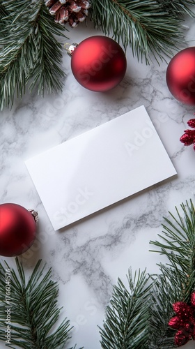 Holiday Greeting Card Surrounded by Red Ornaments and Green Pine Branches