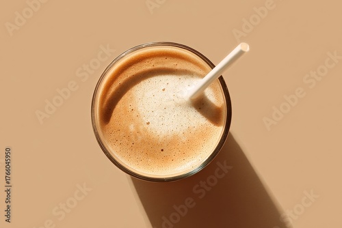 Creamy Beverage With Froth in a Glass on a Smooth Surface During Natural Light