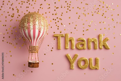 Colorful Hot Air Balloon With Glittery Text on Pink Background Creates a Fest...