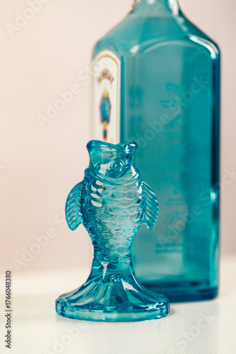 blue glass vase with fish decoration
