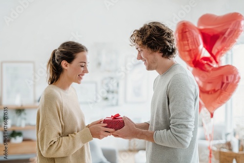 Couple Celebrates Special Occasion With Gifts and Heart-Shaped Balloons in a ...