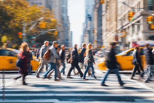 Busy City Street Filled With Pedestrians Crossing at a Crosswalk During Brigh...