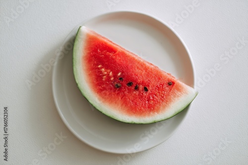 Fresh Watermelon Slice on a Simple White Plate in Bright Natural Light