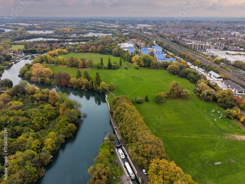 Elevated capture of the River Thames at Reading in Berkshire, UK, showing the Caversham Weir and surrounding parks