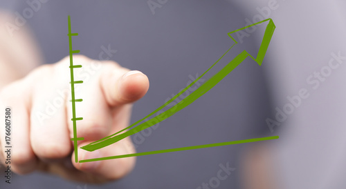 Person points at green arro...