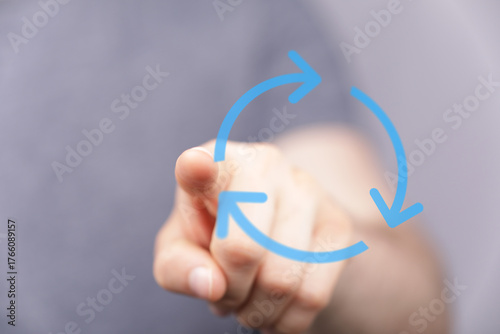Hand pointing at three arro...