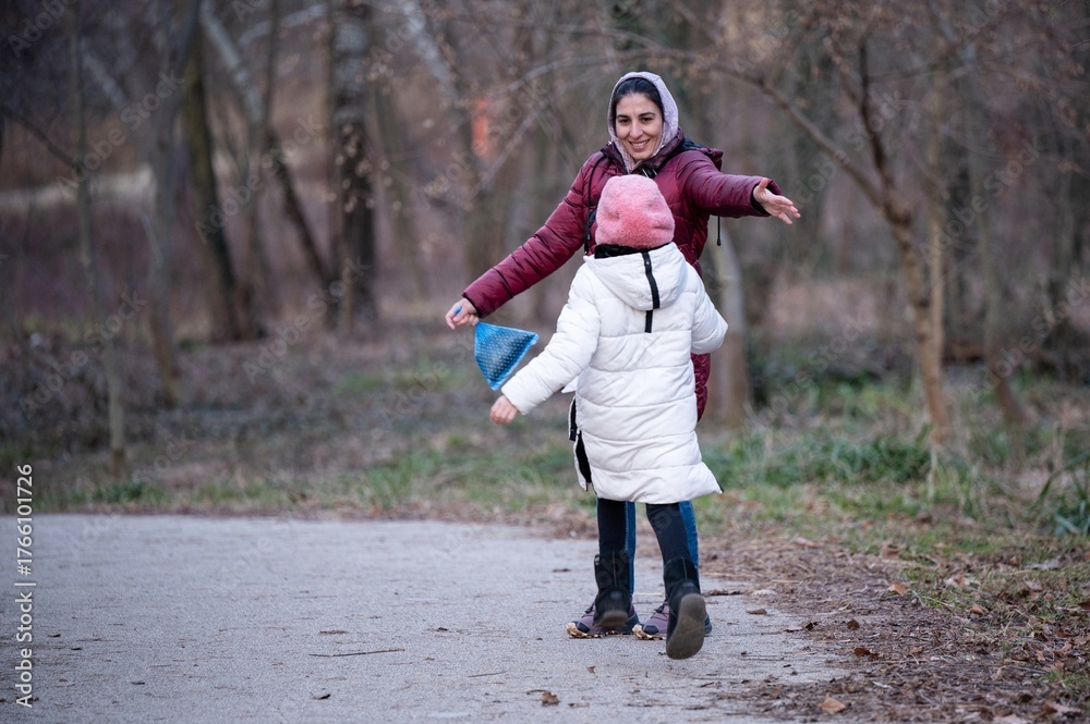 Fototapeta premium Mother and child running, playing, hugging outdoors