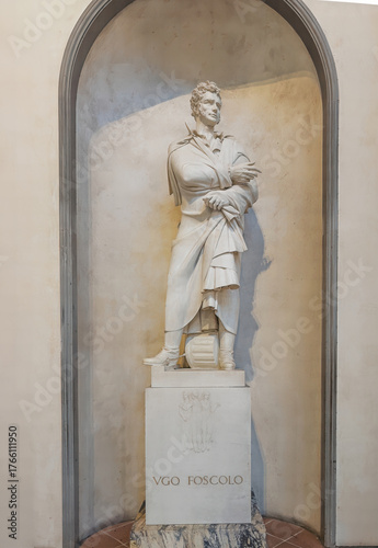 Firenze, Italy, Europe - July 14, 2024: Basilica of Santa Croce. Ugo Foscolo statue, Italian writer and poet