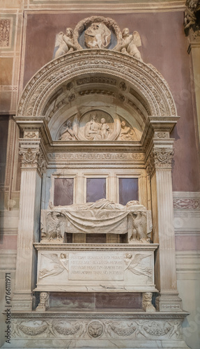 Firenze, Italy, Europe - July 14, 2024: Basilica of Santa Croce. Leonardo Da Vinci memorial monument, Italian Renaissance polymath, with his body statue lying on a table. Other sculptures