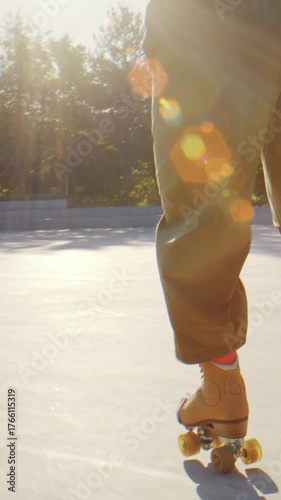 Roller skaters feet gliding across bright plaza at golden hour