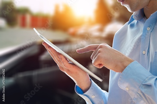 Auto car service concept. Mechanic with clipboard