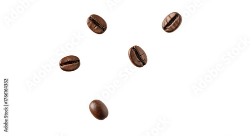 Five whole, roasted coffee beans are scattered and appear to be falling or floating against a neutral, transparent background.