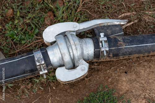 Lasithi plateau, Crete, Greece. 30.09.2023.  Close up of irrigation pipe on fertile land on Lasithi Plateau in eastern Crete, Greece.