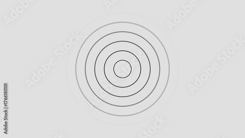 Fading grey concentric circles on a light grey background abstract