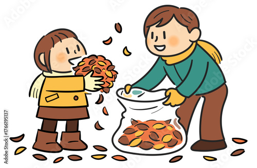 落ち葉を集める父と娘