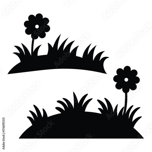 Two silhouetted flower patches with blades of grass against a white background