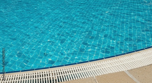 Sunny classic pool scene with blue water and retro tile details creating a nostalgic summer atmosphere ,nostalgic ,swimming ,texture