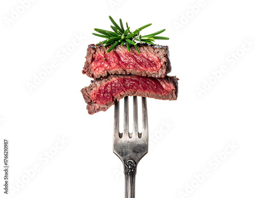 Succulent, medium-rare sliced steak is skewered on a fork, topped with rosemary sprigs against a stark black backdrop