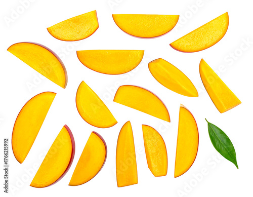 Mango wedges scattered on black backdrop; bright, smooth slices with one vibrant leaf