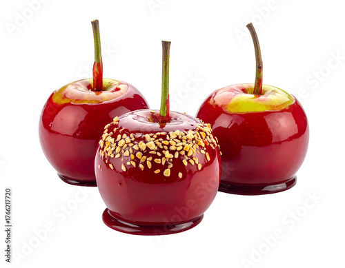 Three candied apples, one covered in nuts, red and glossy, with a stem against a black background