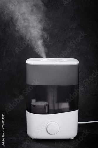 Air Humidifier with Steam on Black Background