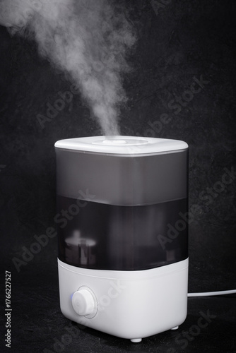Air Humidifier with Steam on Black Background