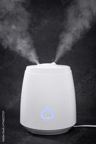 Air Humidifier with Steam on Black Background