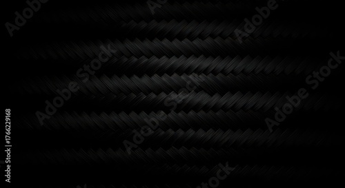 Close up dark industrial carbon fiber material background showing detailed woven pattern and seamless texture for technical design purposes ,seamless ,engineering ,design