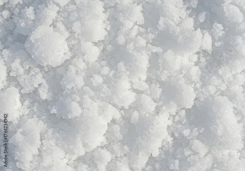 Detailed close up of pristine white fluffy crushed ice texture suitable for cooling drinks and commercial refrigeration needs ,purity ,crisp ,surface