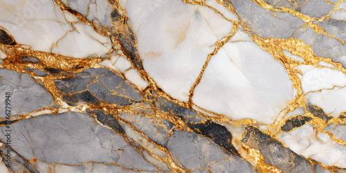 Close up of a polished natural stone slab with intricate veining and golden accents