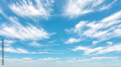 Bright blue sky with wispy clouds creating serene atmosphere