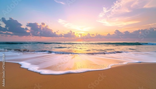 Golden Hour Ocean Beach Sunrise With Gentle Waves Washing Ashore On Sandy Shore Under A Colorful Sky With Clouds