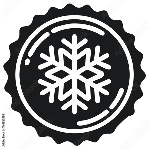 Cold snowflake emblem symbol in a circular frame with jagged edge