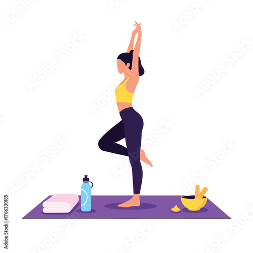 Young woman in sportswear practicing a standing yoga tree pose.