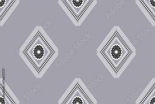 Elegant grey and black geometric ethnic pattern with diamond motifs. Modern and minimal yet inspired by traditional textile art, ideal for fashion fabrics, wallpapers, and sophisticated decorative des