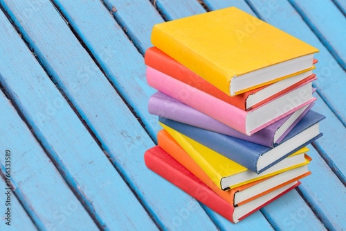 Wallpaper Mural stack of school reading books on color background, Torontodigital.ca