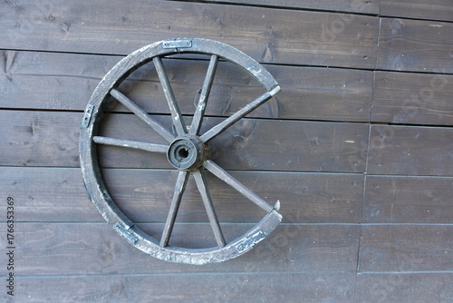 old wooden wheel on the wall