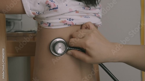 Using Stethoscope to Examine Child - back– Pediatric Healthcare 2