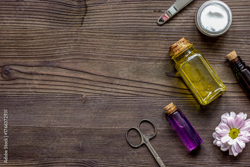 care of nails and cuticle on wooden background top view