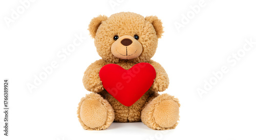 Light brown teddy bear  holding a red heart isolated on white background. Valentine's Day.